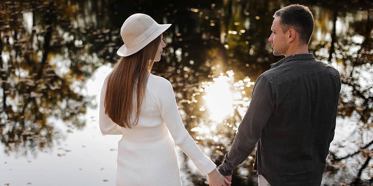 man and woman holding hands