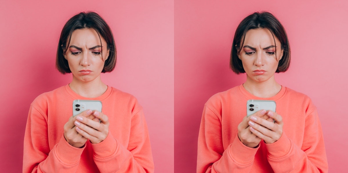 woman in monochrome pink looking at phone