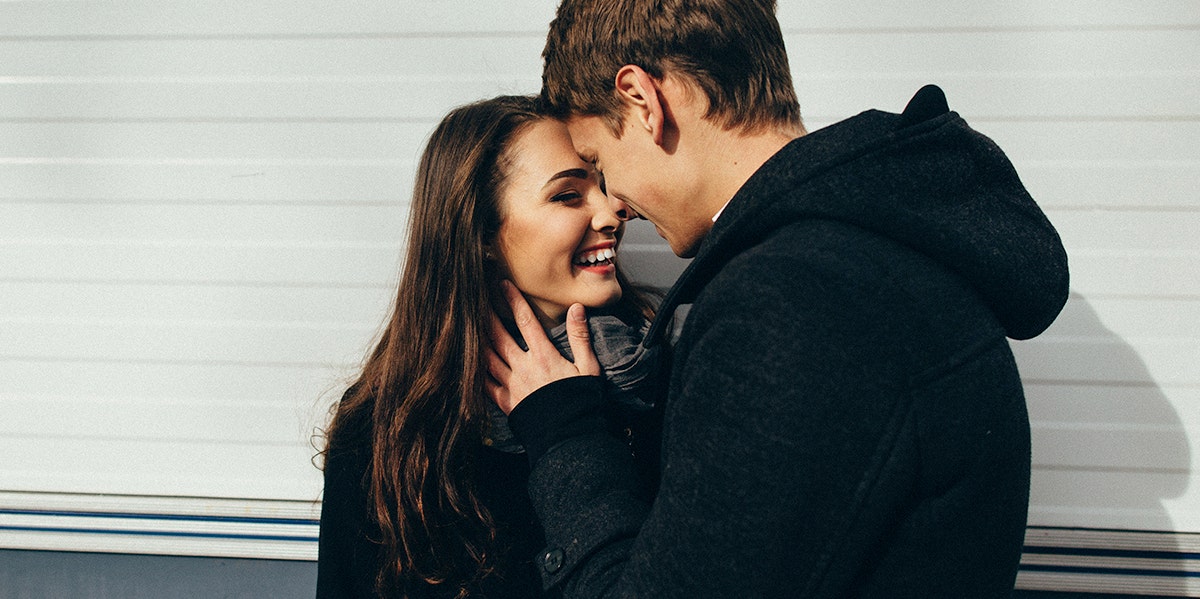 man and woman putting foreheads together 