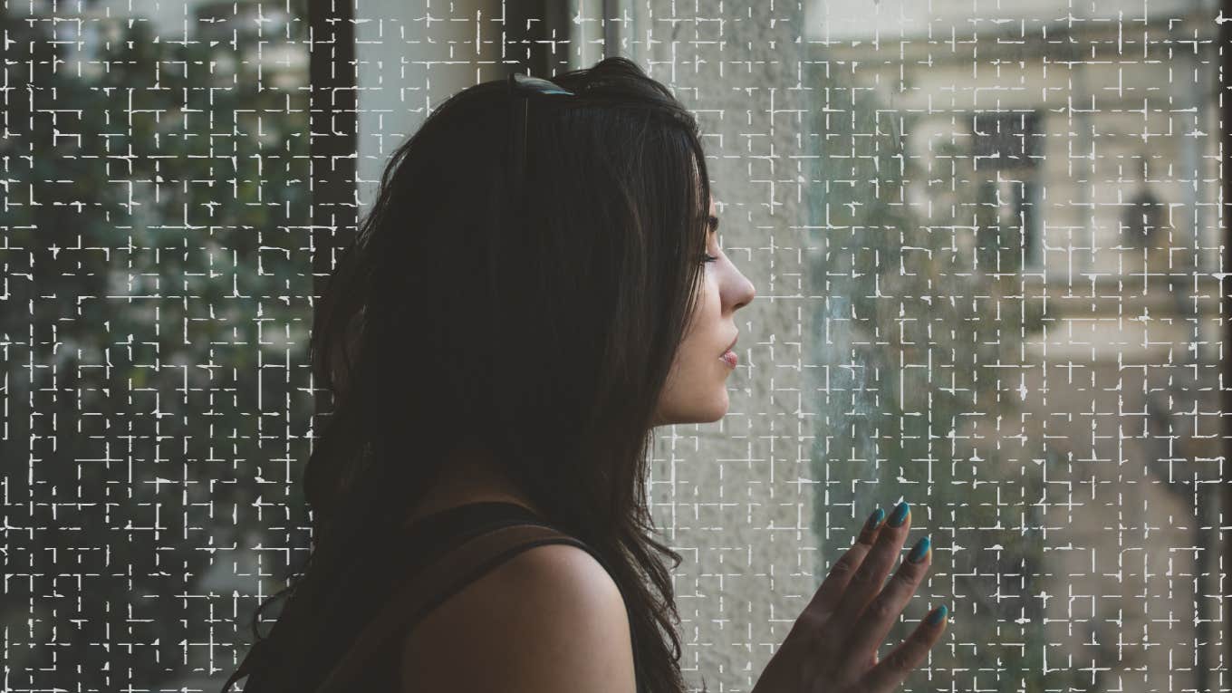 woman longing out window