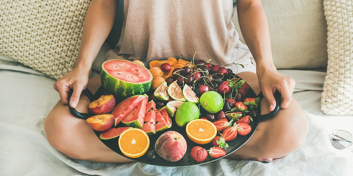 woman with fruit platter