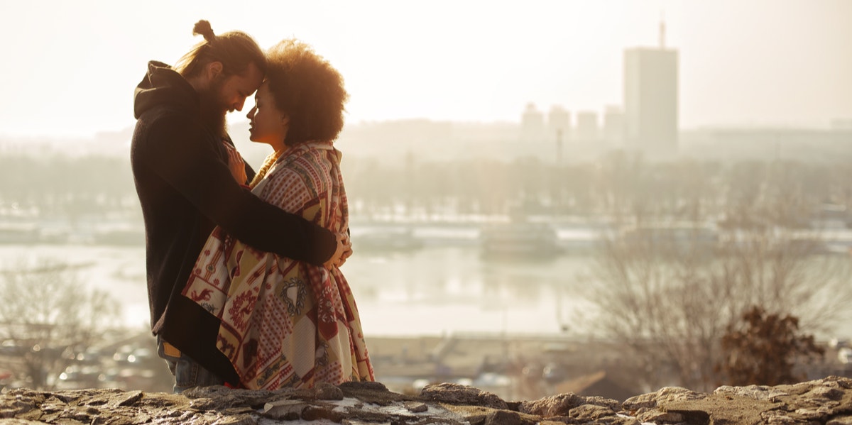 man and woman hugging