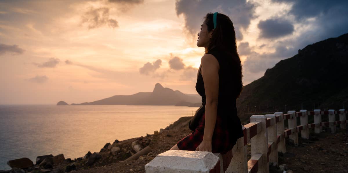 woman looking at sunset