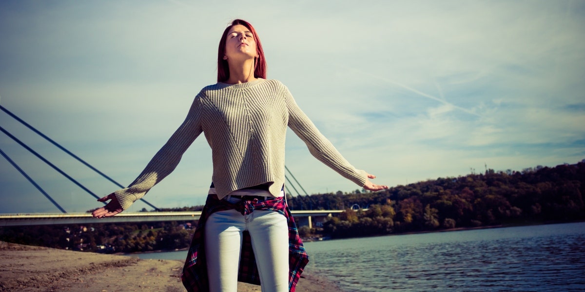 woman meditating outside