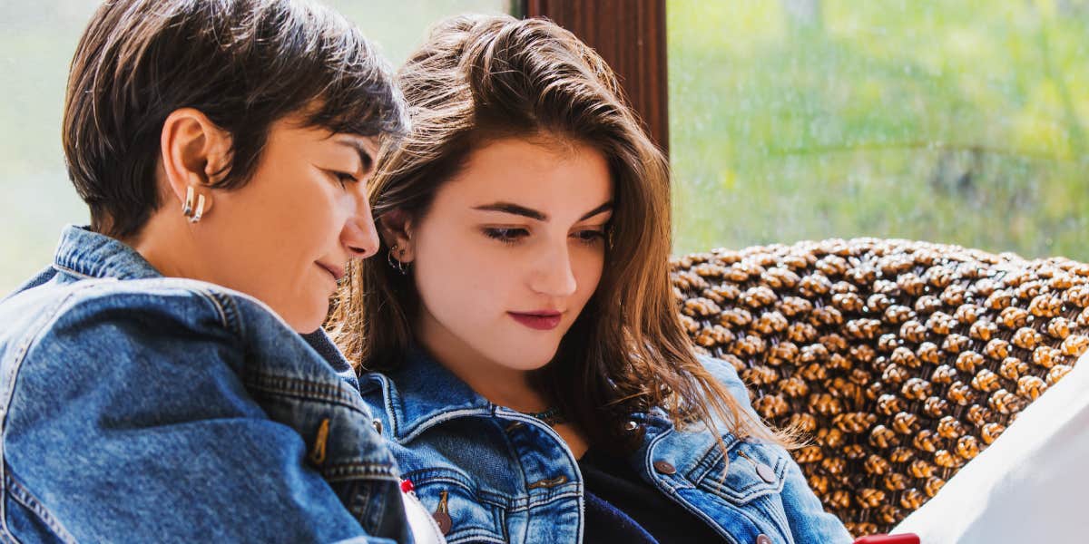 mom comforting teen, both looking serious but caring