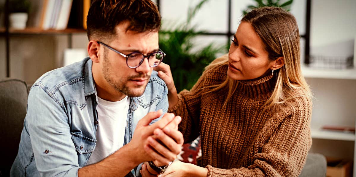 wife talking to her husband, who is crying