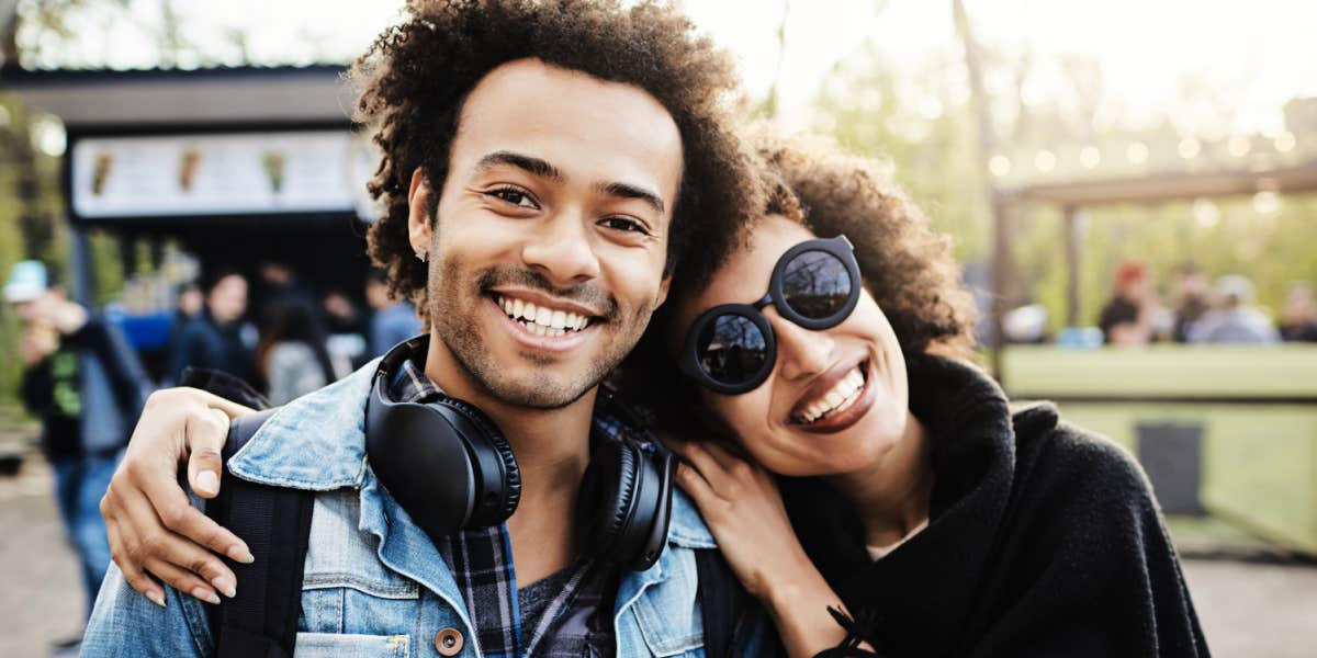 hero of dysfunctional family siblings embrace out on a street