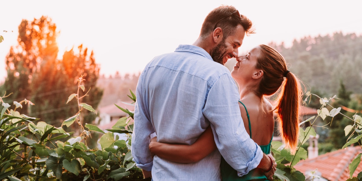 man and woman hugging 