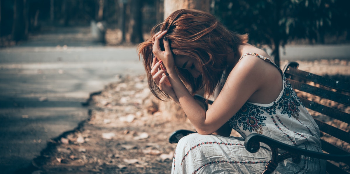 sad woman on bench