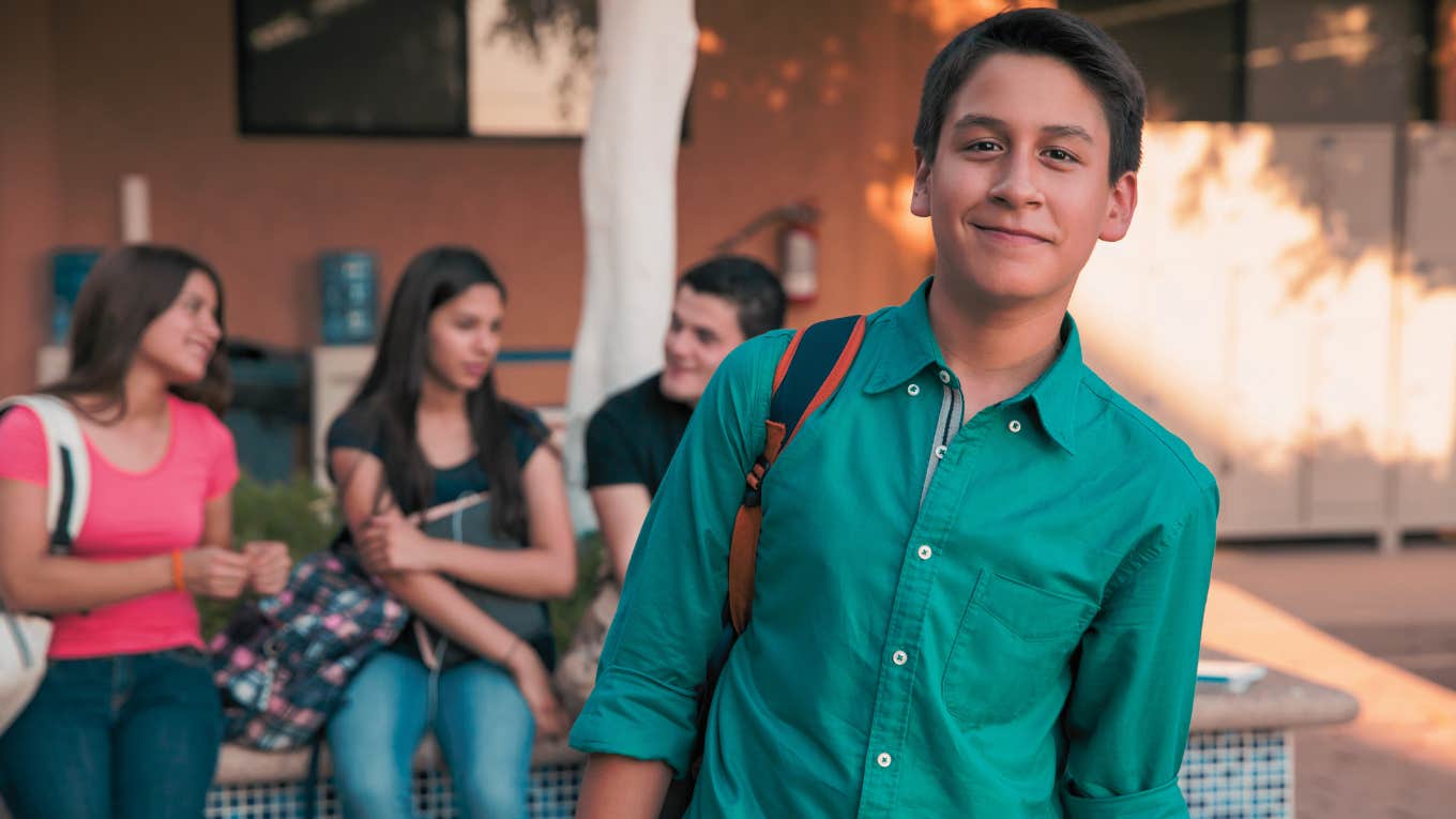high school student smiling while outside