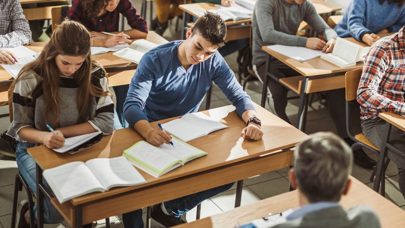 High school students reading in the classroom. 