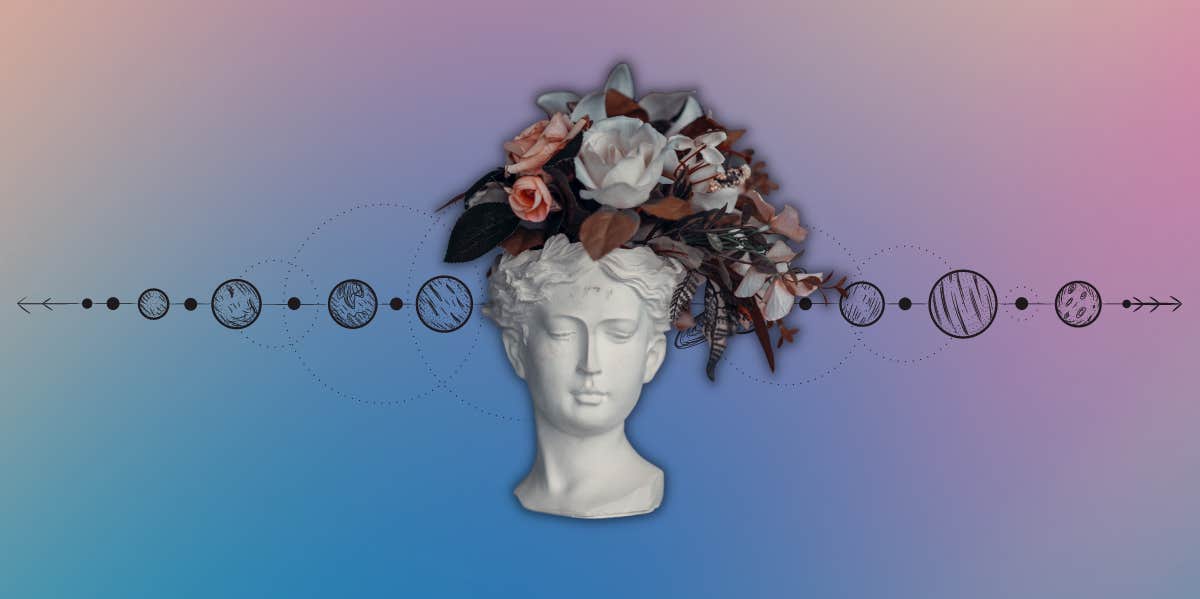 head sculpture with flowers and planets