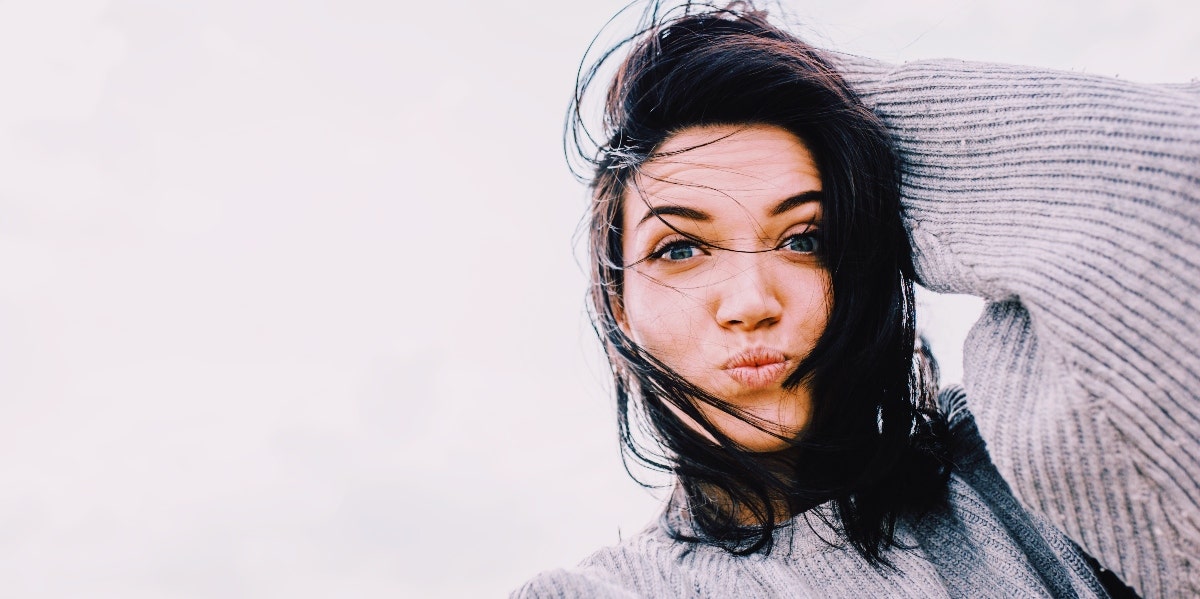 dark-haired woman in a sweater