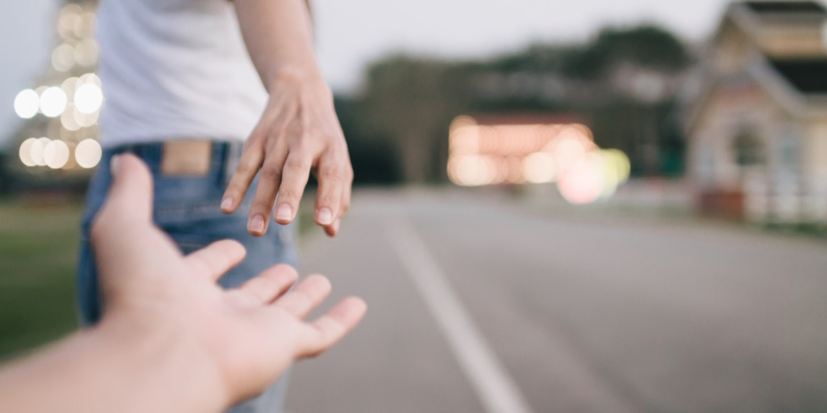 woman letting go of the hand she was holding onto