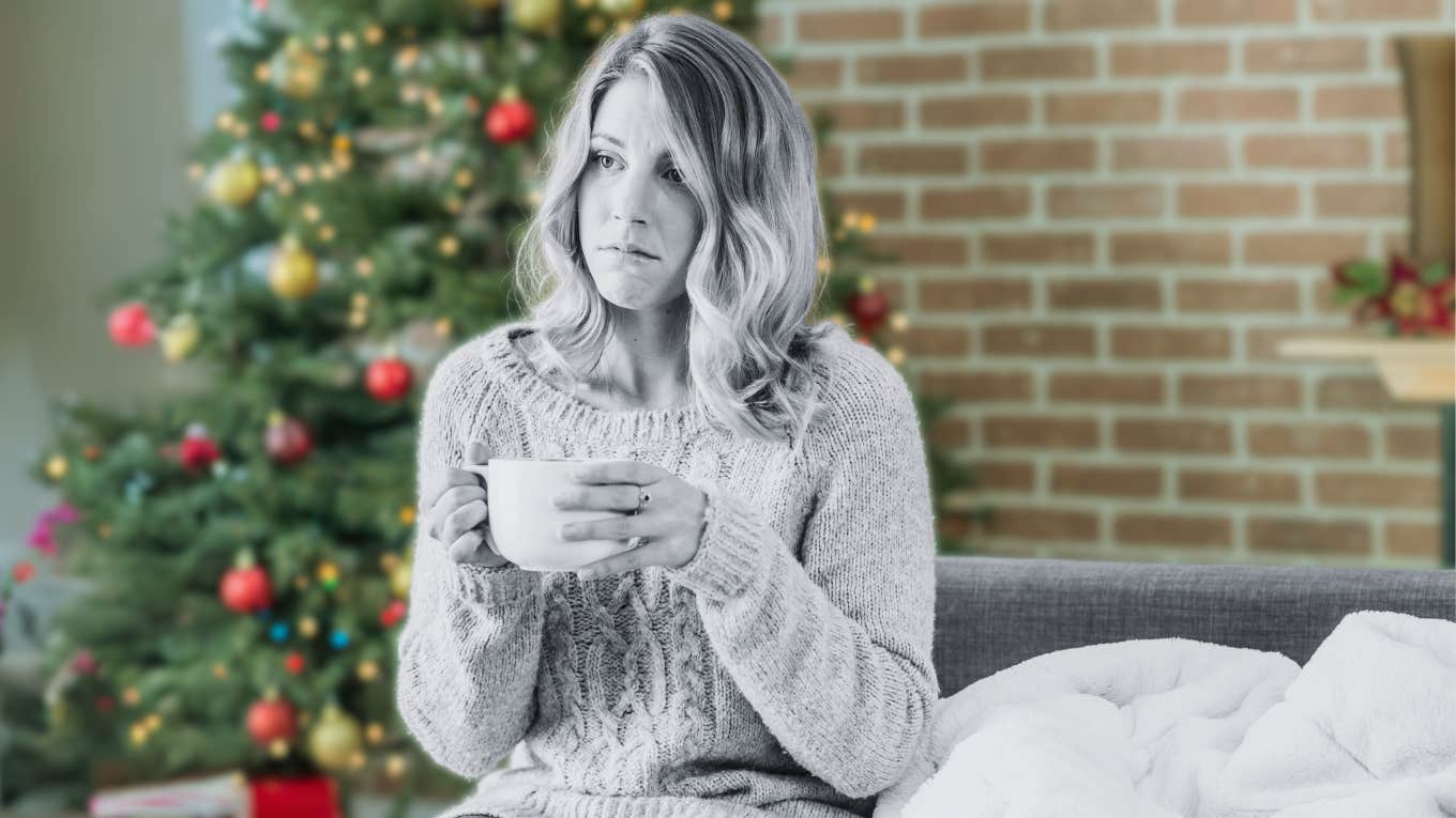 Sad woman in front of Christmas tree