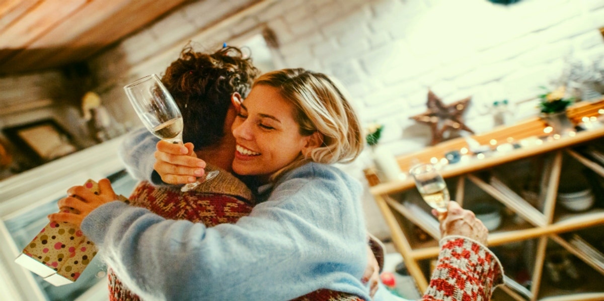 holiday traditions during covid man and woman hugging