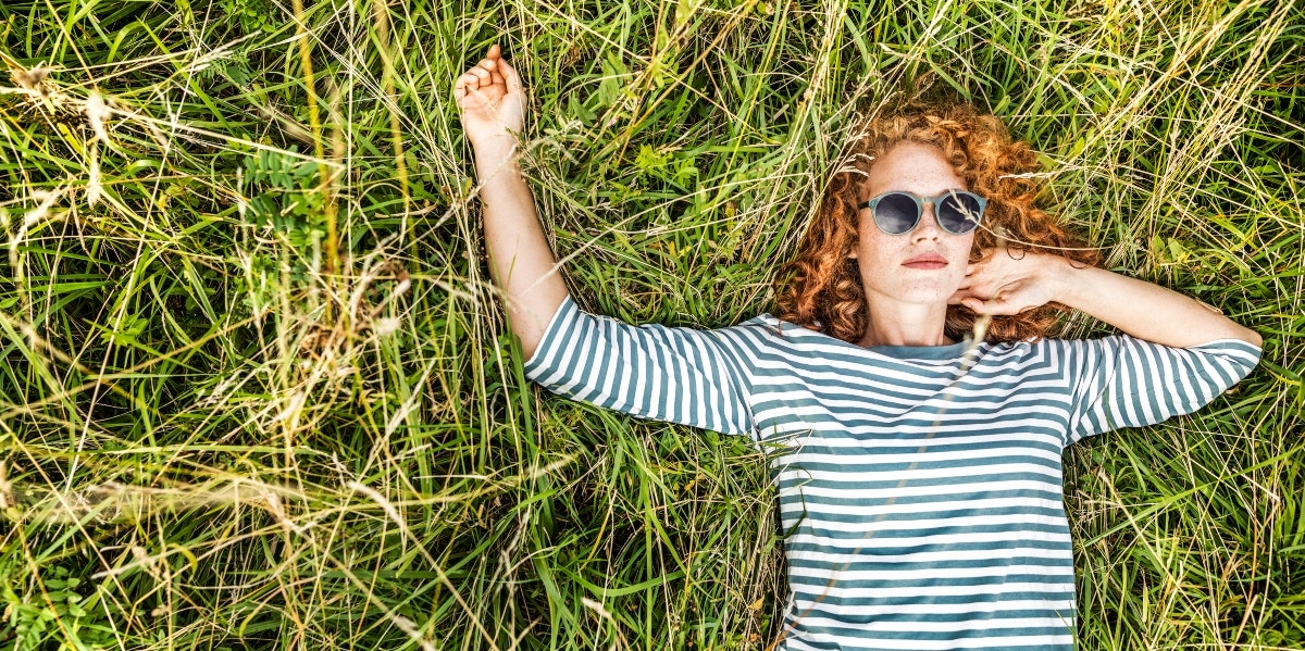 woman lying on the grass