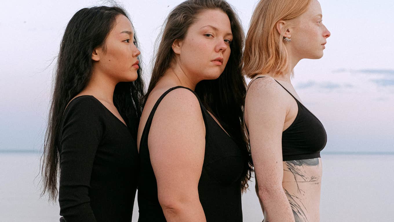 three women standing in a line 