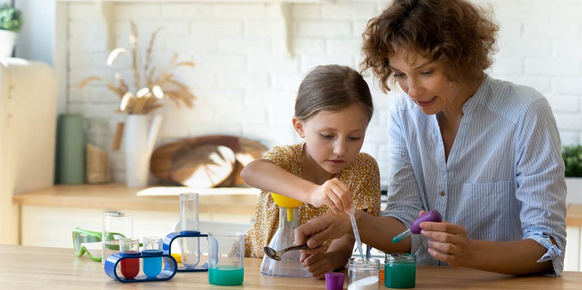 Mother and child playing with toys together. 