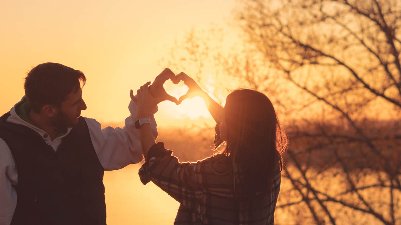 Horoscopes Are Lucky In Love For 3 Zodiac Signs On October 31, 2023 couple making heart with hands