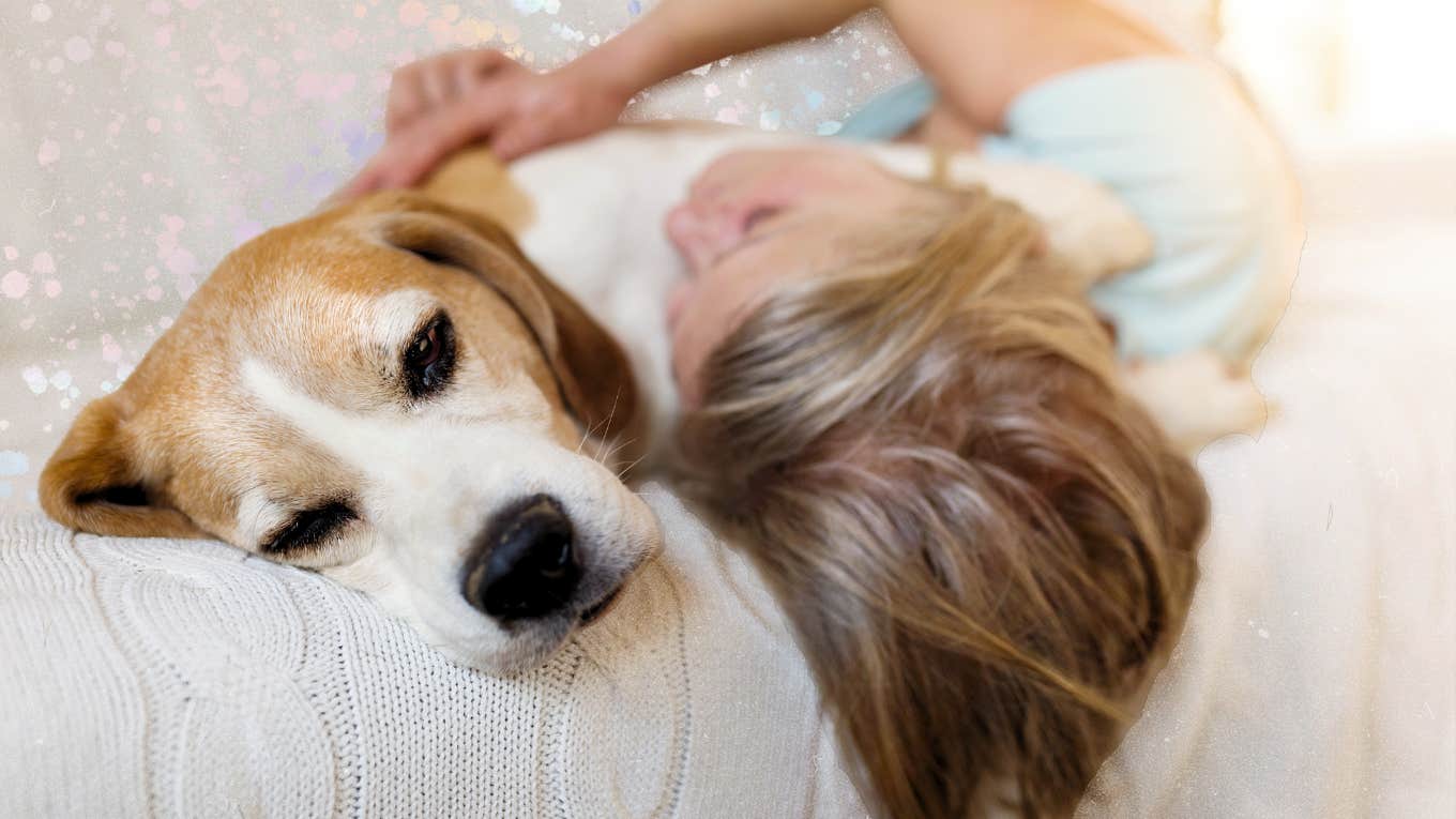 Woman snuggling her dog