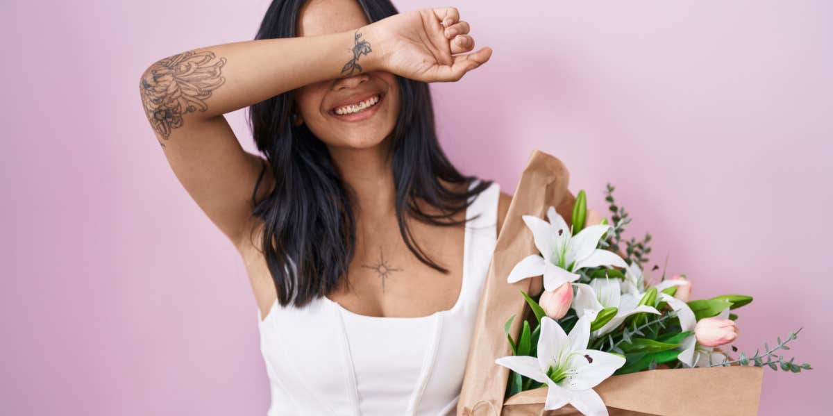 woman holding flowers