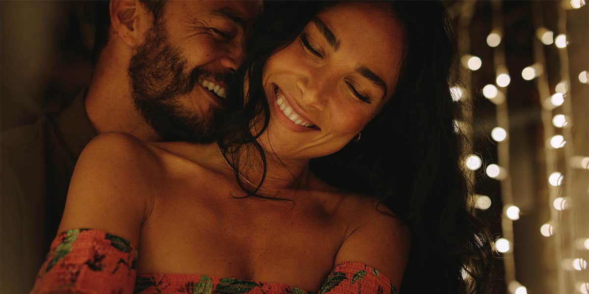 10 Simple Ways To Show A Man Intimacy (Without Jumping Into Bed) smiling couple cuddling