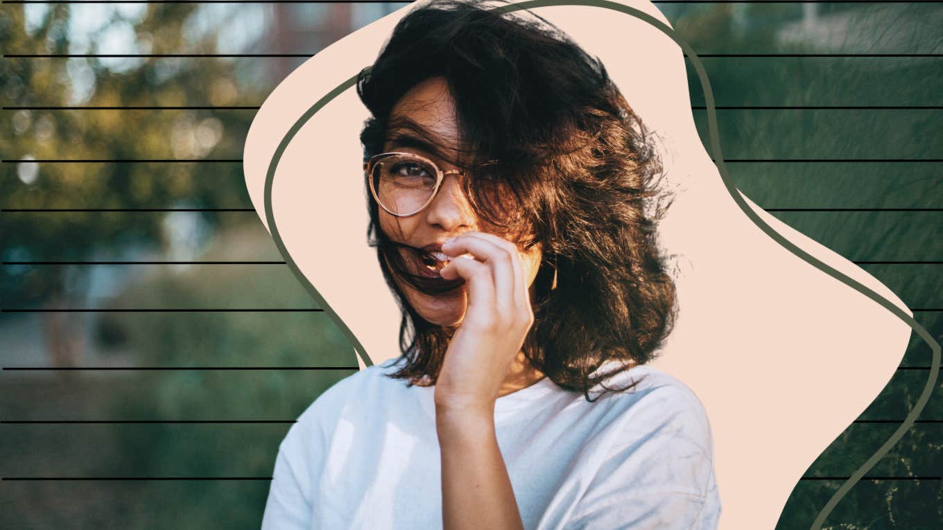 Woman playing with hair smiling 