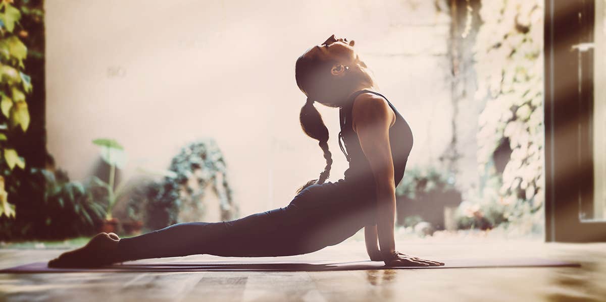 Unsexy Morning Habits Of Extraordinarily Successful Humans woman doing yoga stretch