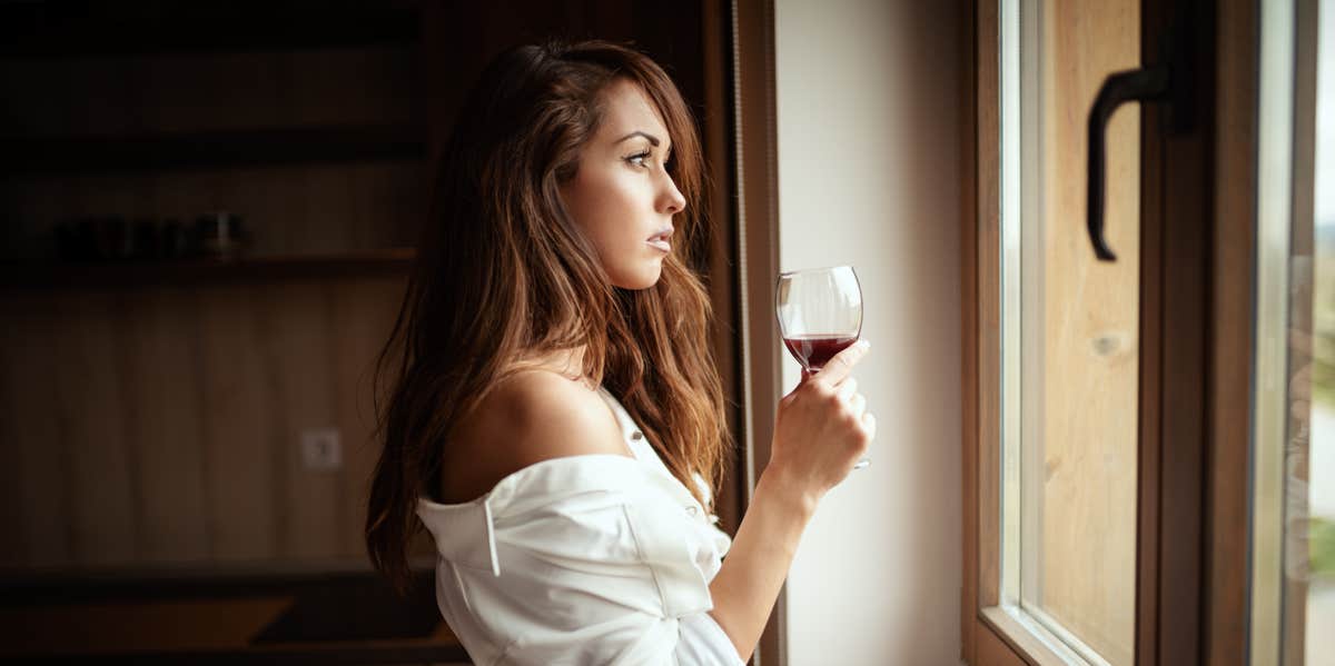 sad woman drinking wine 