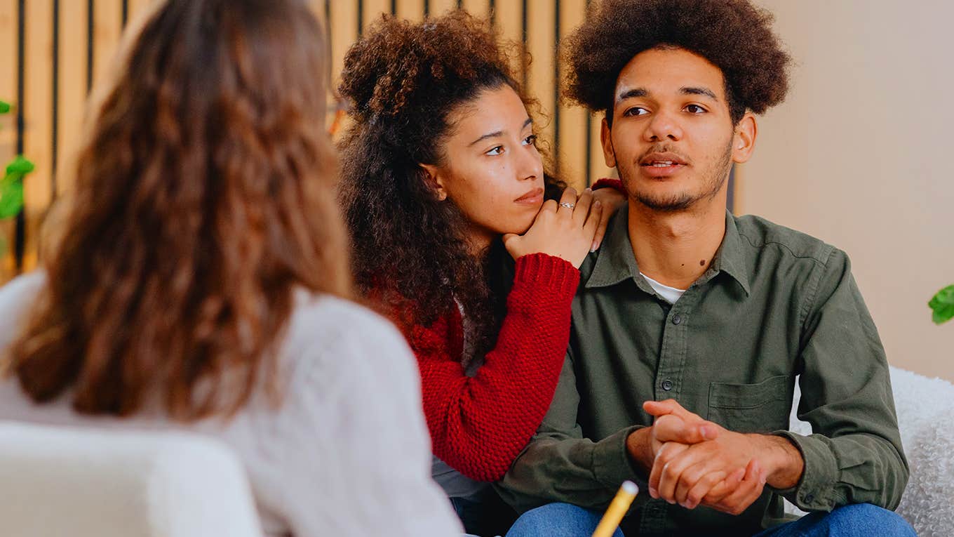 young couple talking to counselor 