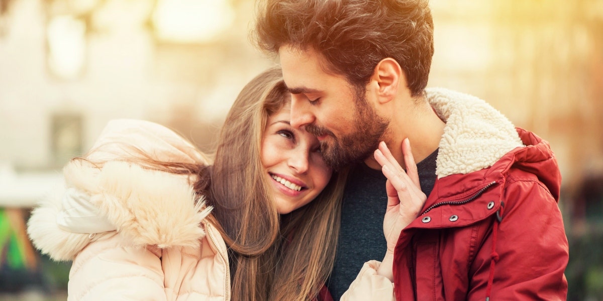 happy man and woman hugging