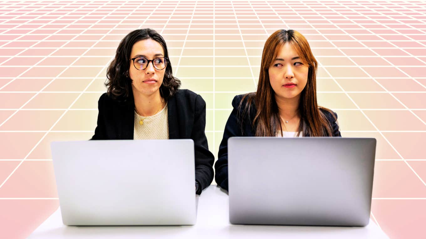 Two women sitting at desks, tangible tension