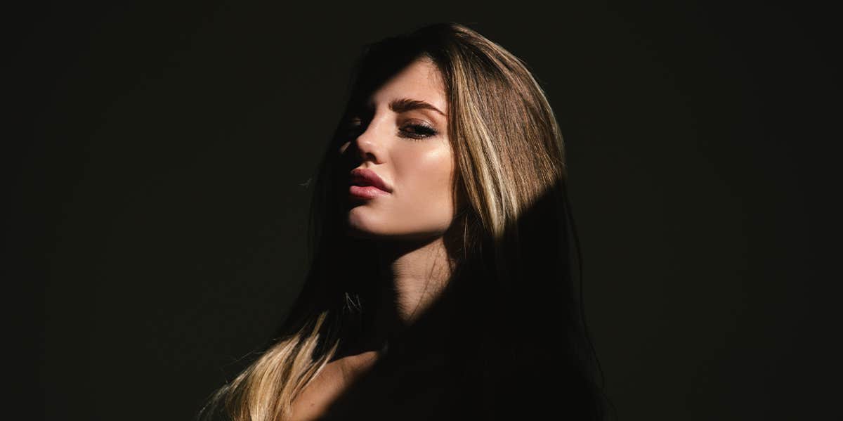 How to deal with somebody else’s internal drama (it can be easier th woman in dramatic lighting