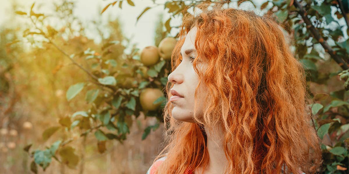 girl with red hair outside