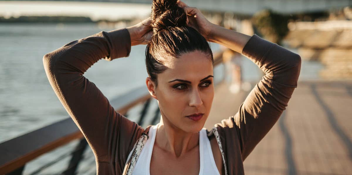 woman doing a messy bun