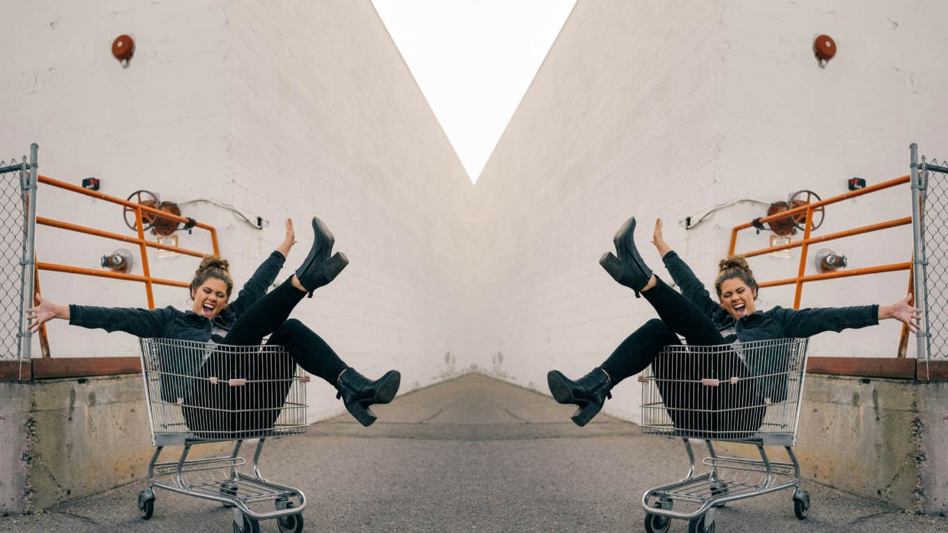 Woman having the best time in a shopping cart