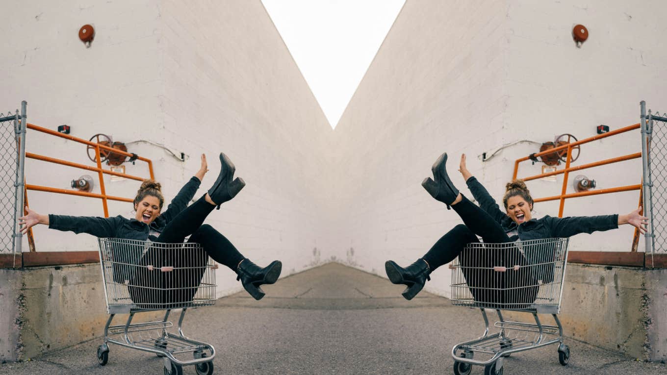 Woman having the best time in a shopping cart