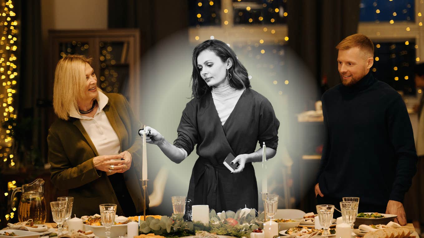 Woman lighting candles at holiday dinner table