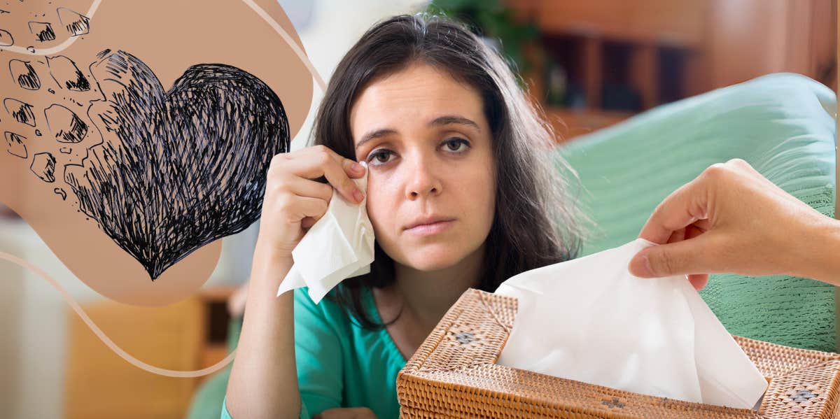 Woman crying on couch with tissues