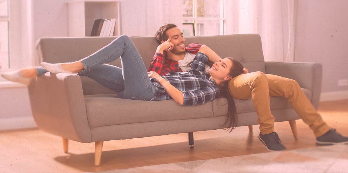Couples In The Healthiest Relationships All Show Their Partners Love In One Specific Way woman and man lying on the couch
