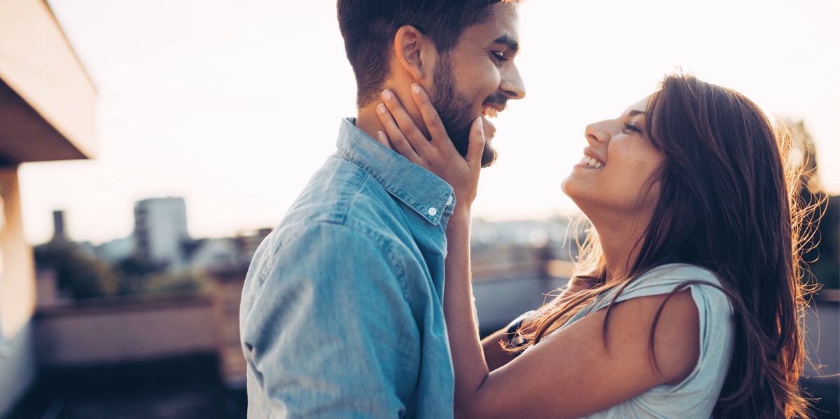 man and woman embracing and laughing