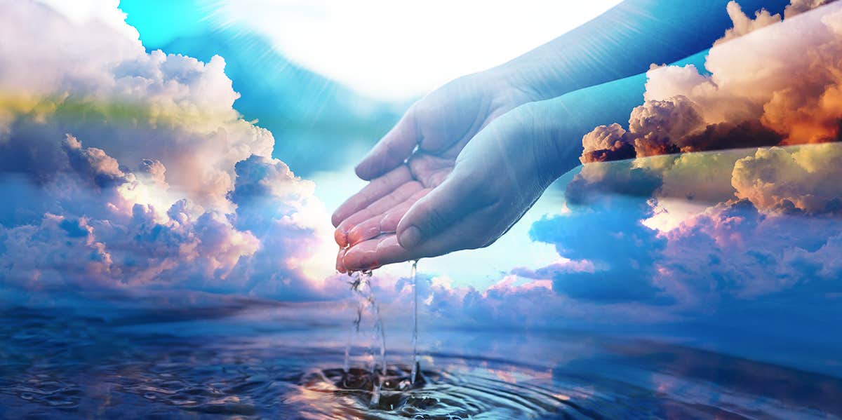 How Is Holy Water Made & How To Make Your Own person touching water