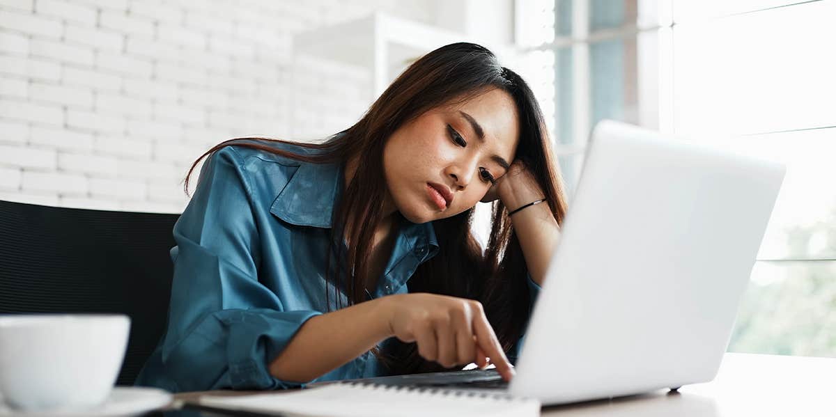 bored woman at laptop