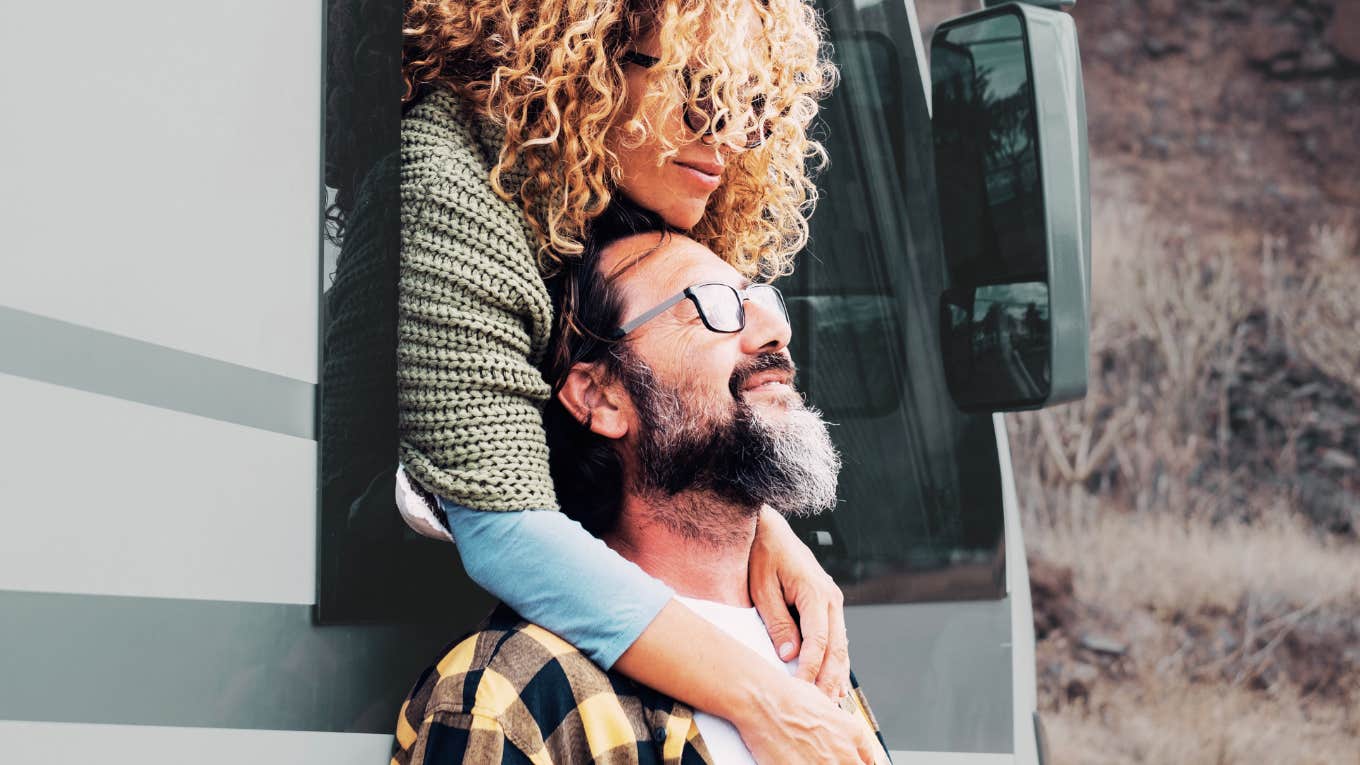 Couple in bus hugging 