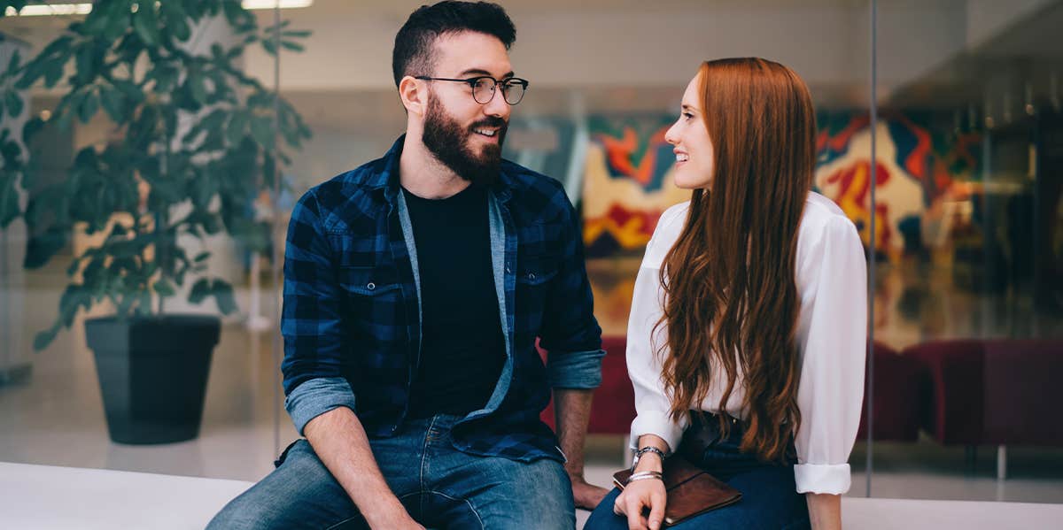 man and woman sitting talking