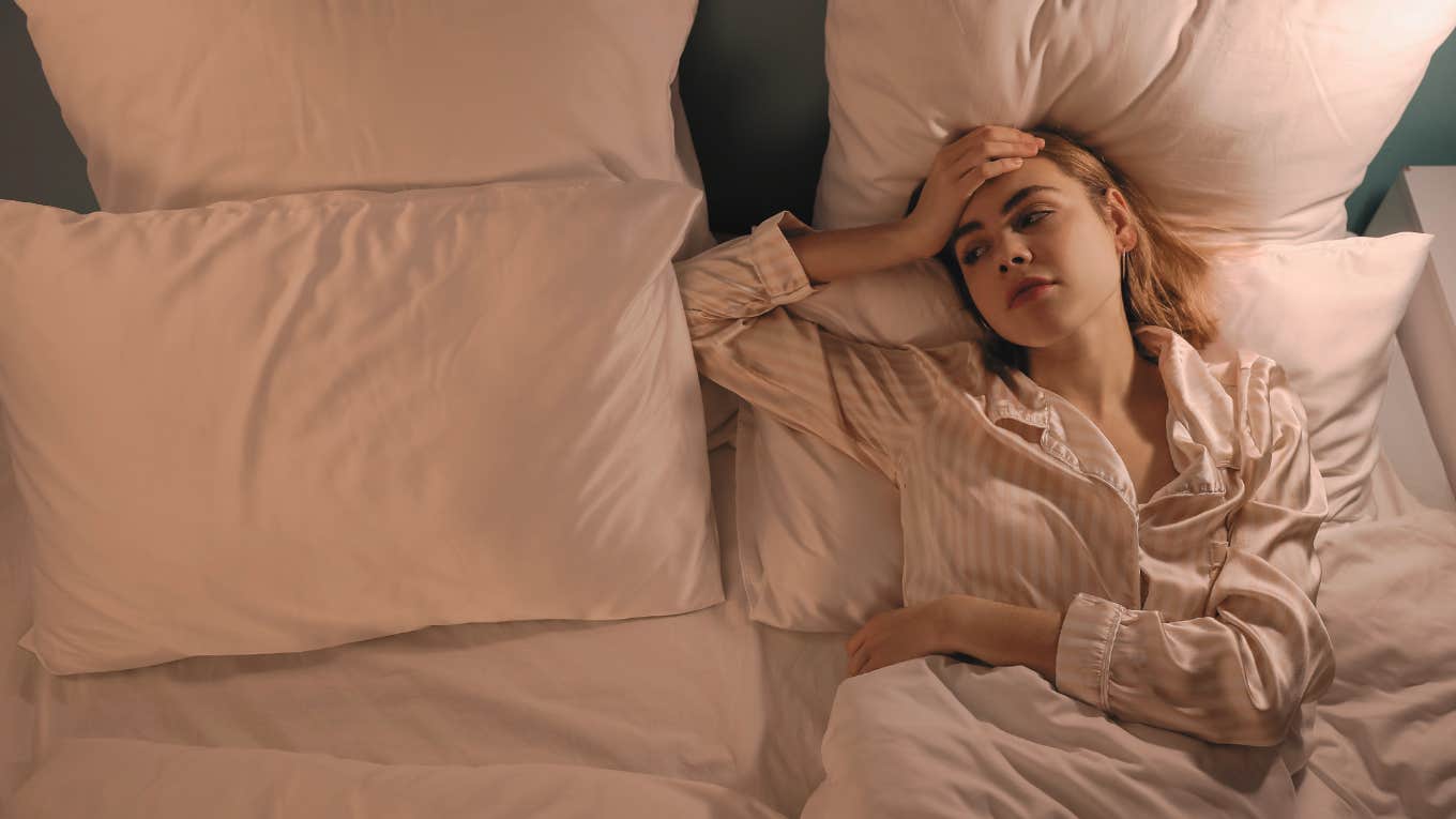 If You’re Not Falling Asleep In This Amount Of Time, There Might Be A Problem woman trying to fall asleep in bed
