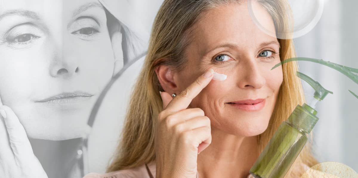 Woman applying cream to her face