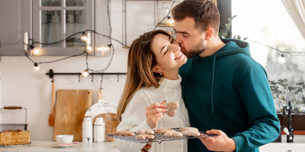 happy wife and husband making cookies