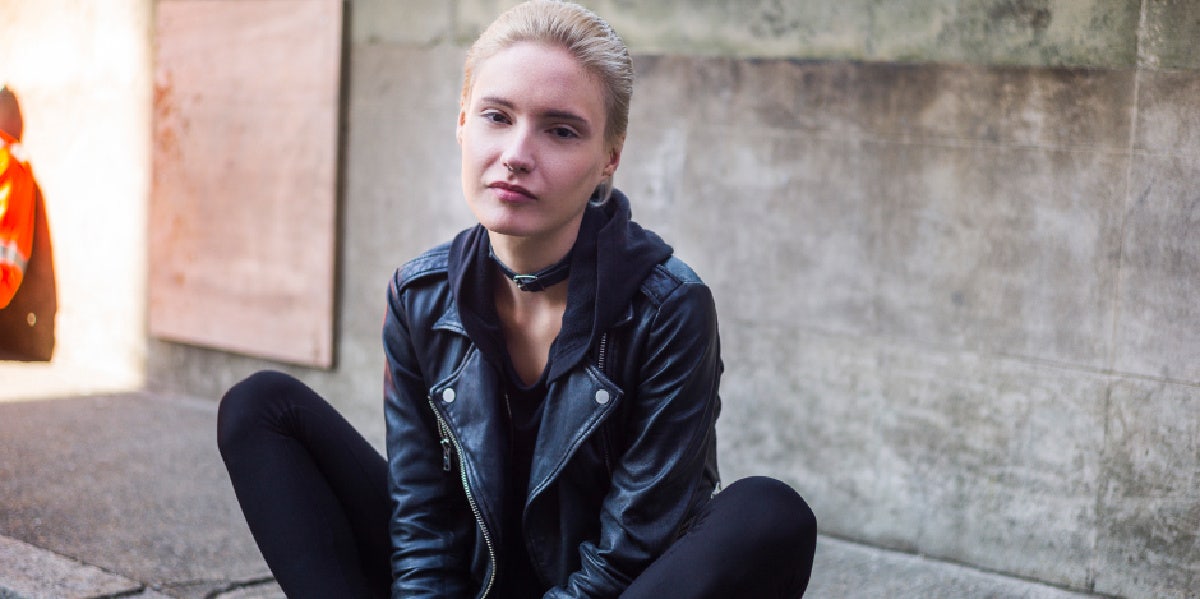 woman in leather jacket sitting